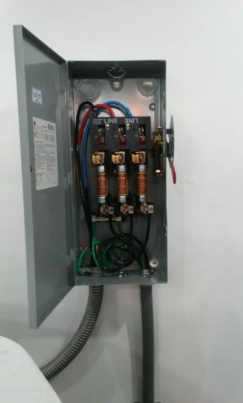 Three-phase disconnect switch installed for Smoke Detector Installation in Epsom