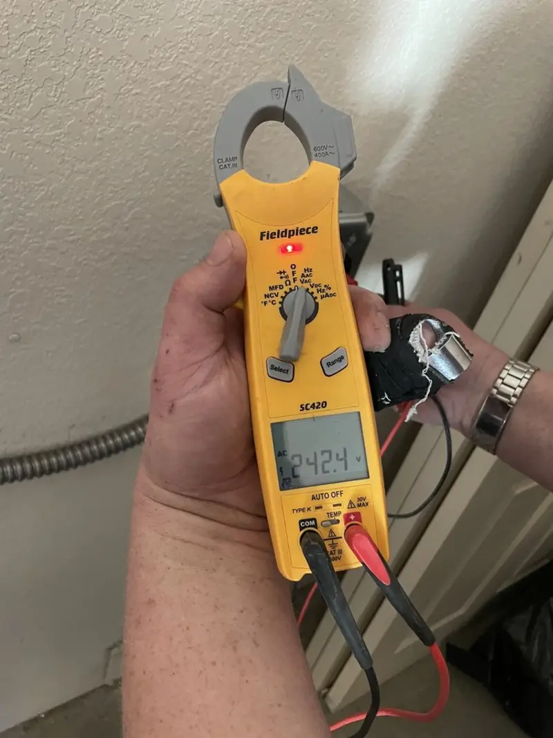 Voltage testing with clamp meter during Outlet Installation in Epsom